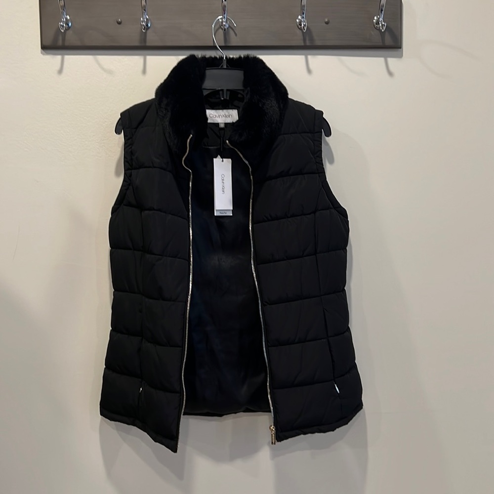 Brand new Calvin Klein puffer vest with faux fur collar!!